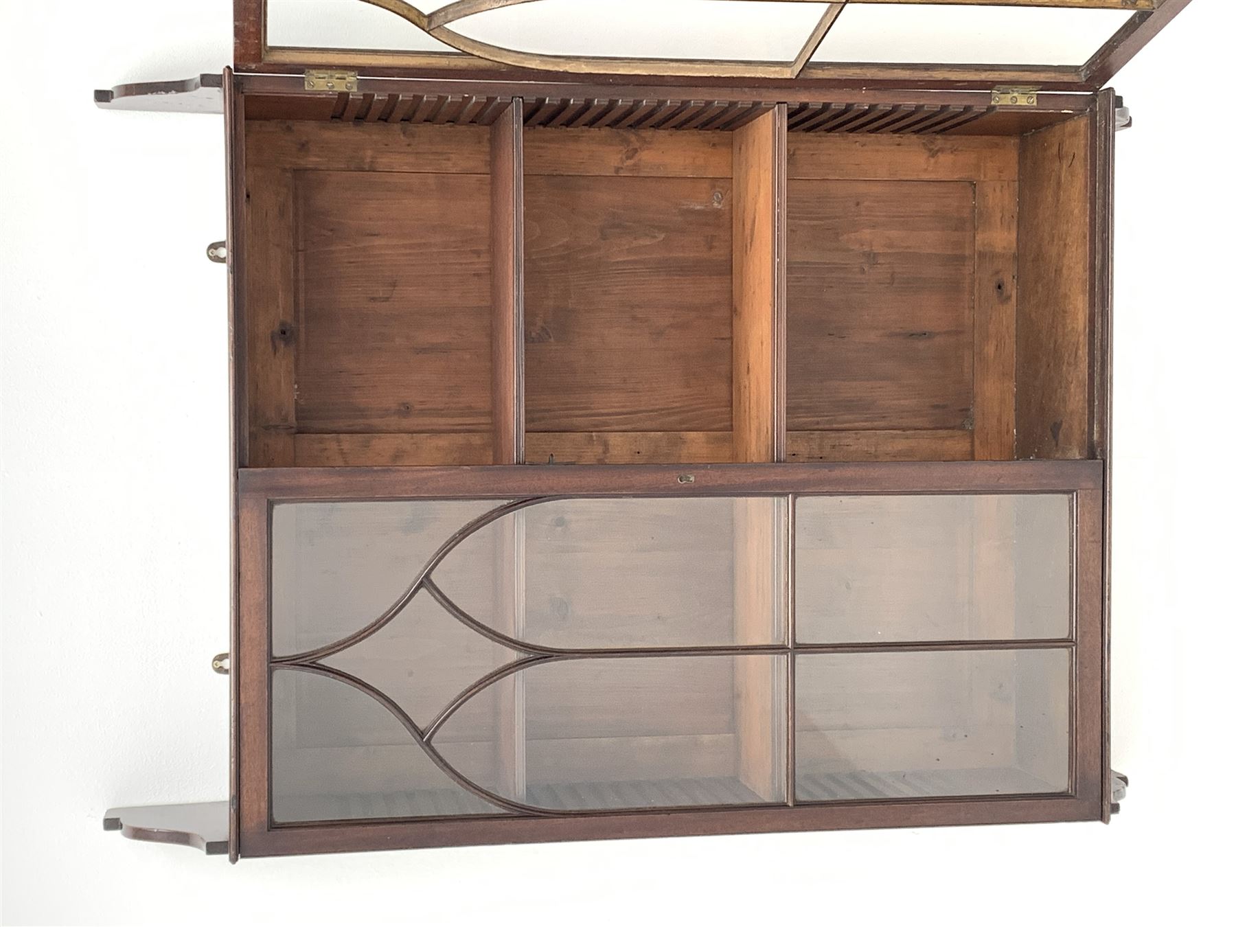 Georgian mahogany Gothic wall hanging cabinet, enclosed by two ogee pointed arch astragal glazed doors, plain sides with shaped top and bottom brackets