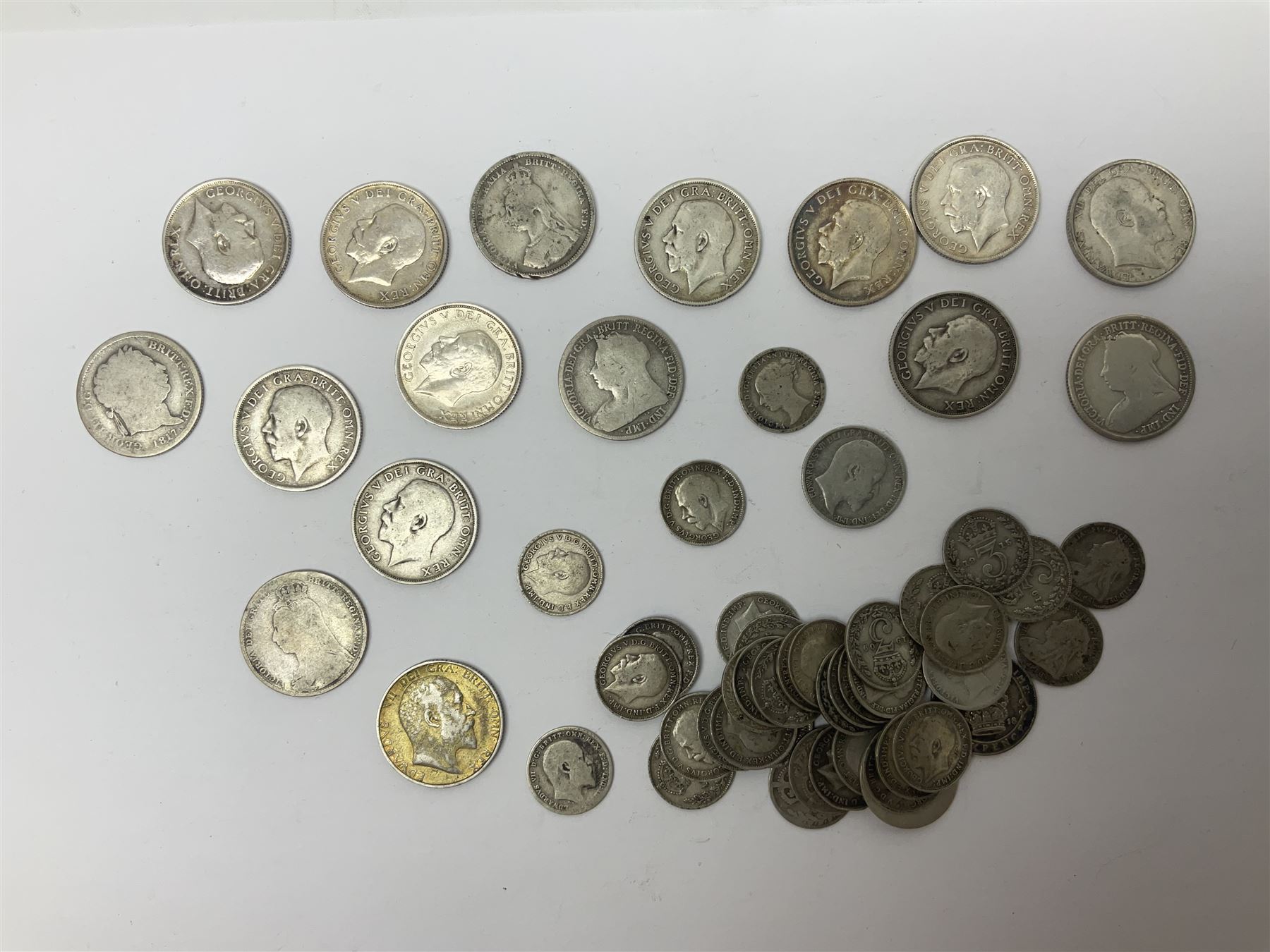 Approximately 145 grams of Great British pre 1920 silver coins, including one shillings, sixpences and threepence pieces 