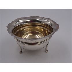 1930s silver open sucrier, of circular form with girdle, with shaped rim and upon three pad feet, hallmarked Birmingham 1931, together with silver fork and spoon set, decorated in relief with foliate pattern to handles, hallmarked William Devenport, Birmingham 1896 to blades and Sheffield 1896 handles