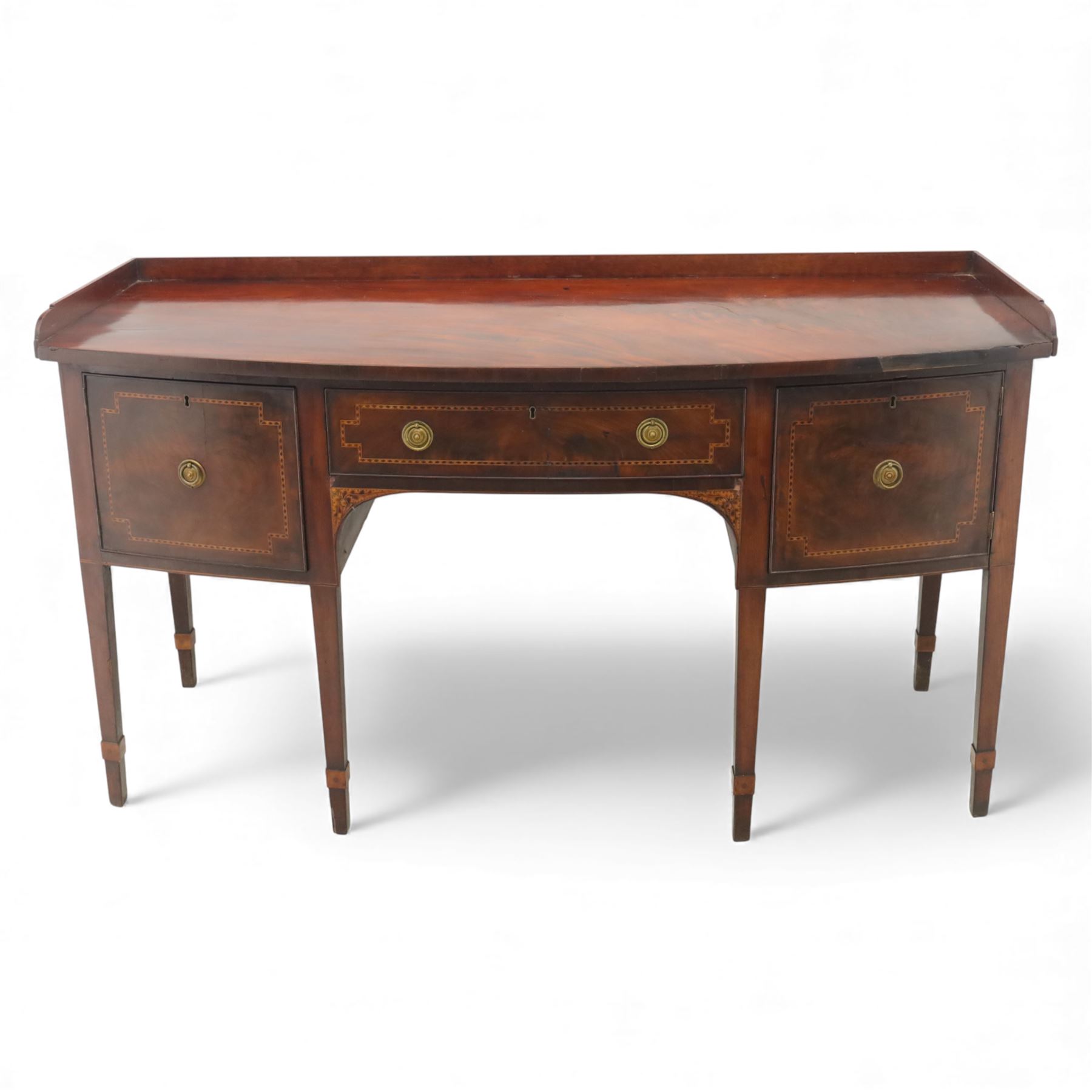  George III mahogany bow-front sideboard, the top with shaped gallery back above one frieze drawers, each outlined with strung inlay, flanked by deep cupboard doors, raised on square tapering legs with spade feet