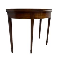 George III mahogany tea table, demi-lune fold over top, double gate-leg action base, square tapering supports with spade feet