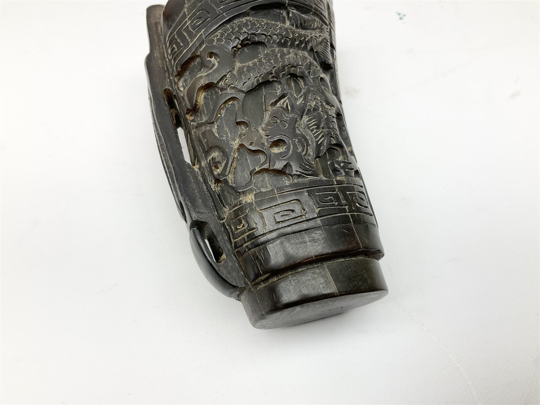 Chinese horn blood collection cup, carved with dragons and key fret border, H9.5cm