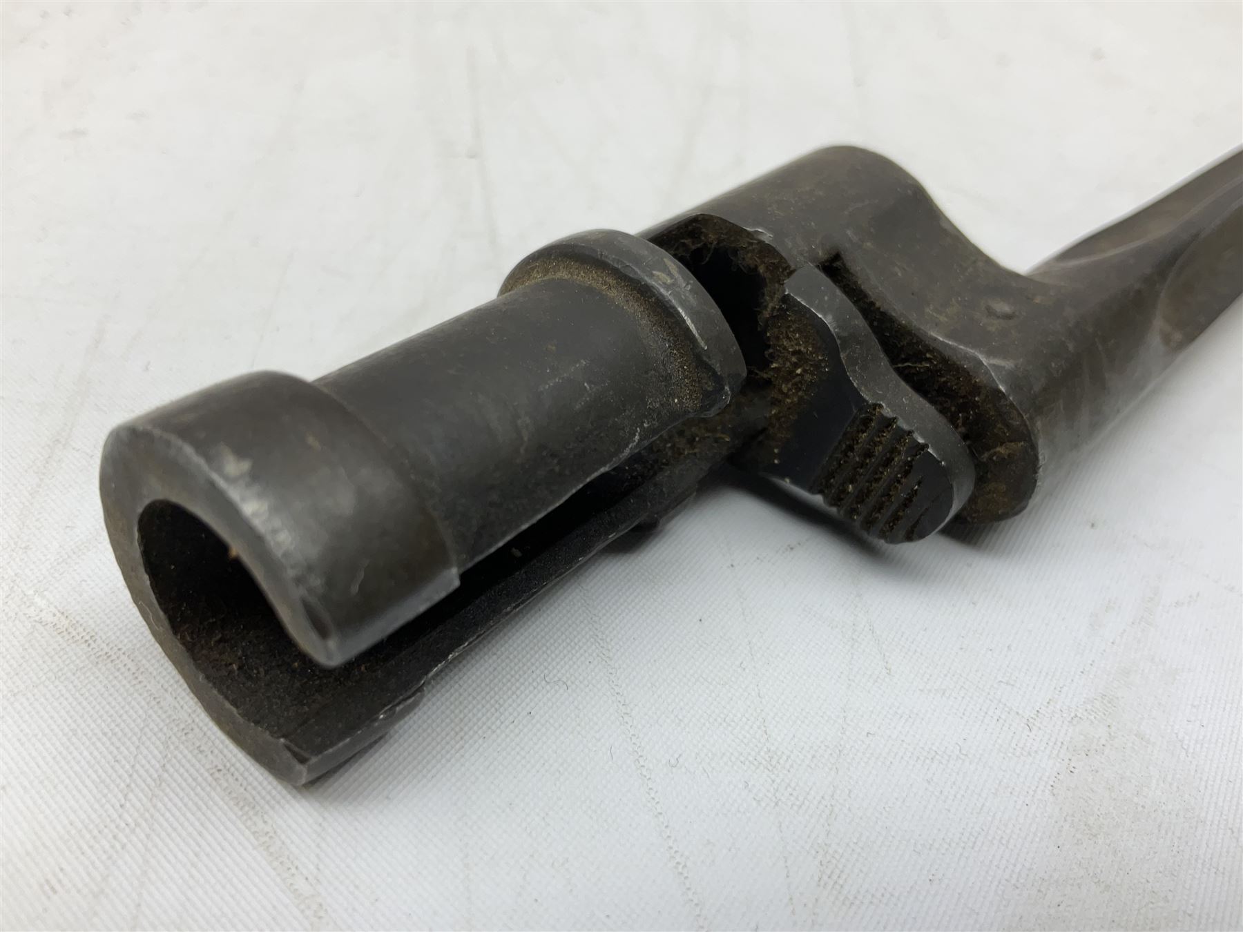 British Pattern 1876 socket bayonet with 43cm steel triangular blade L52cm overall; another socket bayonet with cruciform blade; No.4 Mk.II spike bayonet in metal scabbard with webbing frog; and 1955 Army jack knife by J.H. Thompson Sheffield (4)