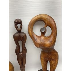 Helen Skelton (British 1933 – 2023): Three carved wooden abstract sculptures, each modelled as a a figure, tallest H52cm. Born into an RAF family in 1933 in Kent and travelled the world extensively during her childhood. After settling in Bridlington, Helen immersed herself in painting, textiles, and wood sculpture, often inspired by nature's beauty. Her talent was showcased in a one-woman show at Sewerby Hall and recognised with the sculpture prize at Ferens Art Gallery in 2000. Sadly, Helen’s daughter passed away from cancer in 2005. This loss inspired Helen to donate her sculptures to Marie Curie upon her passing in 2023.