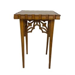 20th century ecclesiastical Gothic style oak stand, rectangular top on four square tapering supports, with pierced and carved tracery brackets