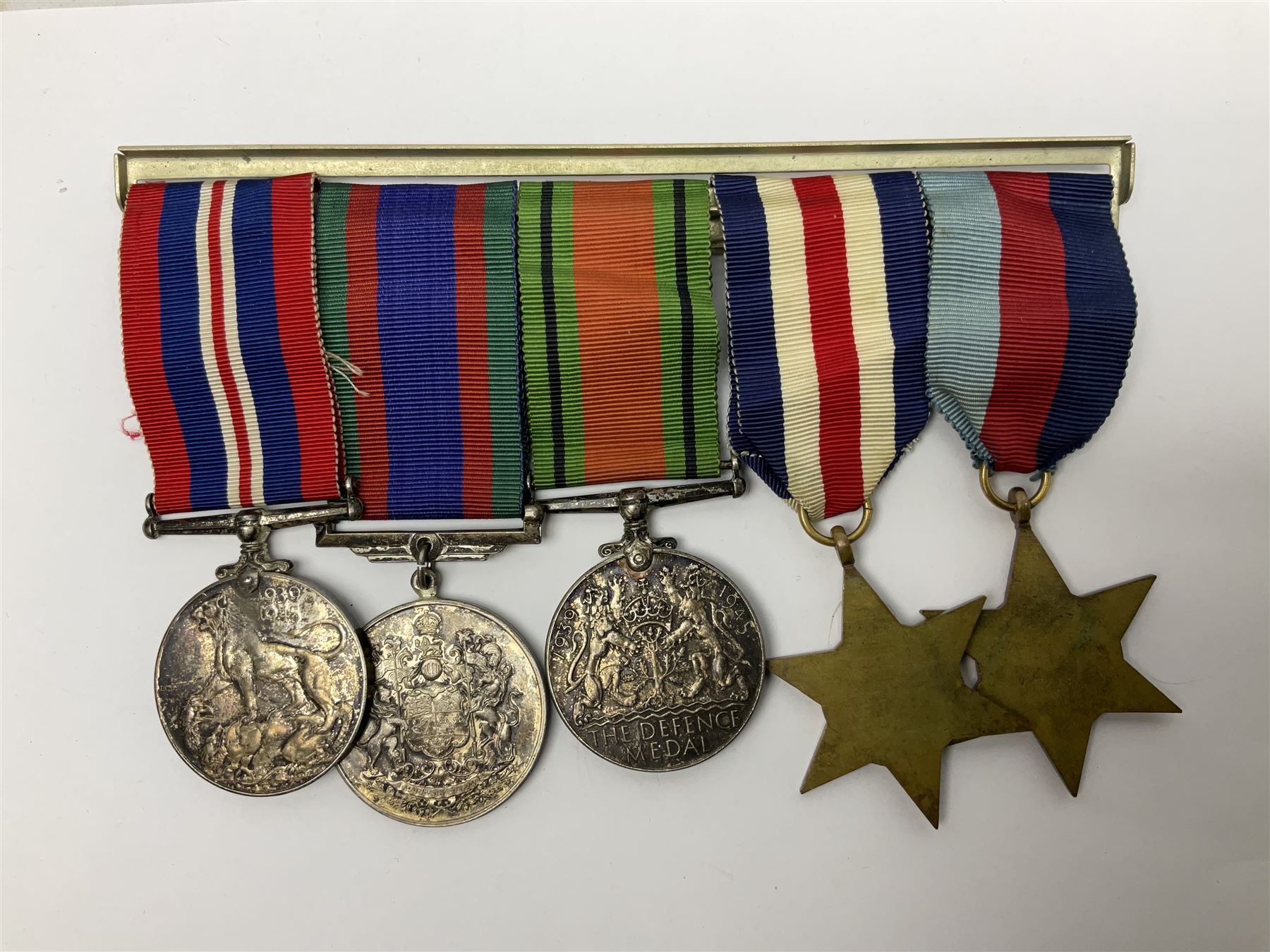 WW2 group of five medals comprising 1939-1945 War Medal, Defence Medal, 1939-1945 Star, France and Germany Star and Canadian Volunteer Service Medal; on wearing bar with ribbons; with a medal box and slip and three photographs