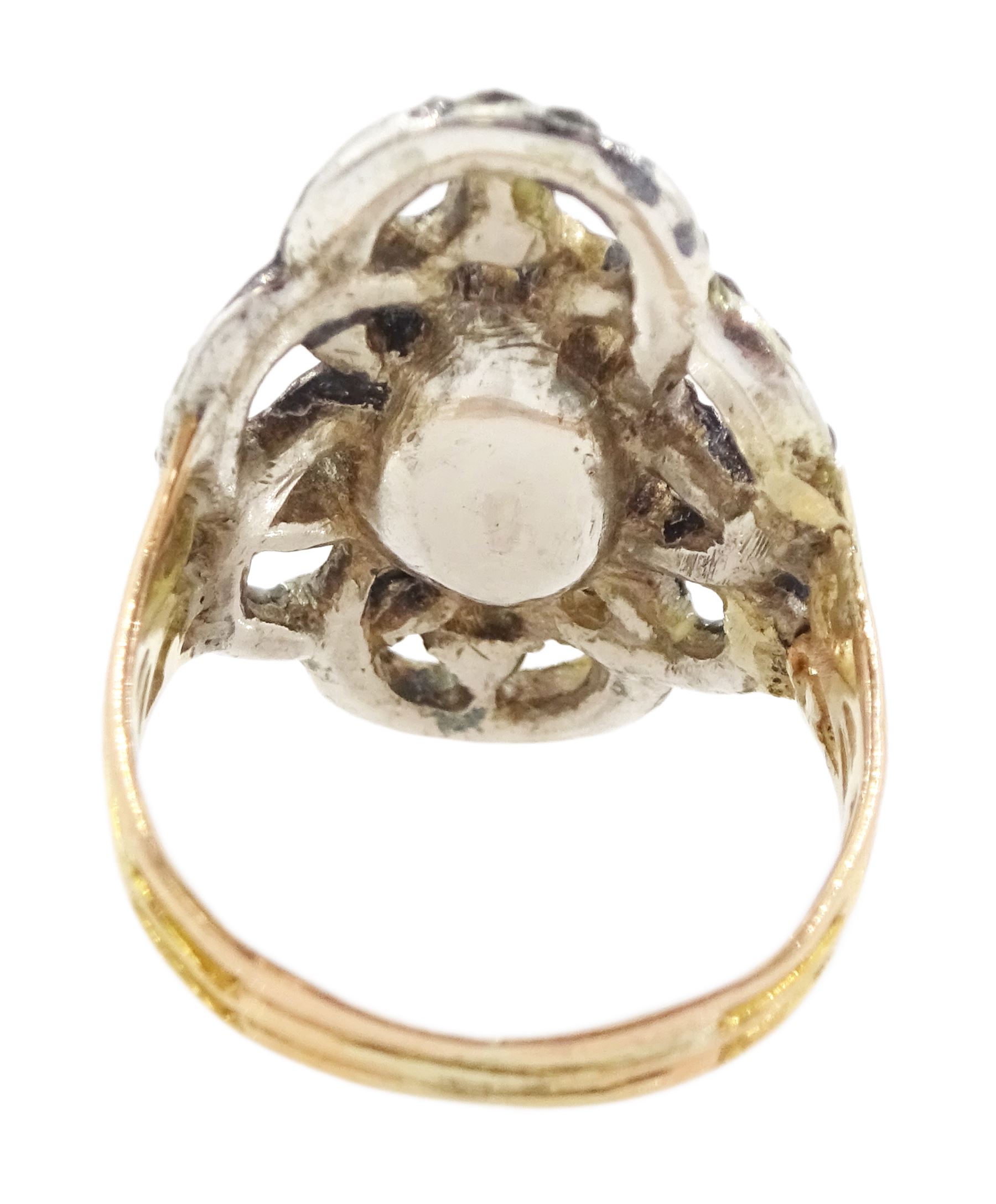 19th century gold and silver marcasite portrait ring, set with an oval miniature of a woman on ivory, under a glazed panel, with a marcasite and red stone set crossover surround, with pierced gold shoulders and reeded shank. This lot has been registered for sale under Section 10 of the APHA Ivory Act