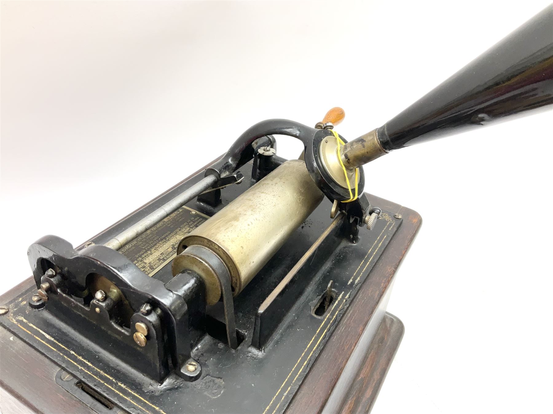Edison Standard Phonograph with oak base (no cover), the reproducer marked 'Model C', serial no. 634857, last patent date Oct.1905, with black japanned conical horn L33cm; together with five cylinders