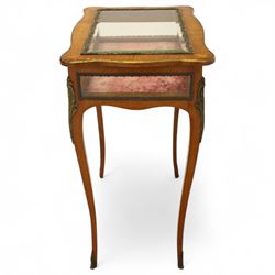Louis XV revival style walnut bijouterie table, rectangular serpentine form, with brass edging and a hinged floral marquetry inlaid lid with bevelled glass top and sides, gilt-bronze beaded border, interior lined with rich red velvet, raised on slender cabriole legs with gilt bronze masks and sabots, circa 1900