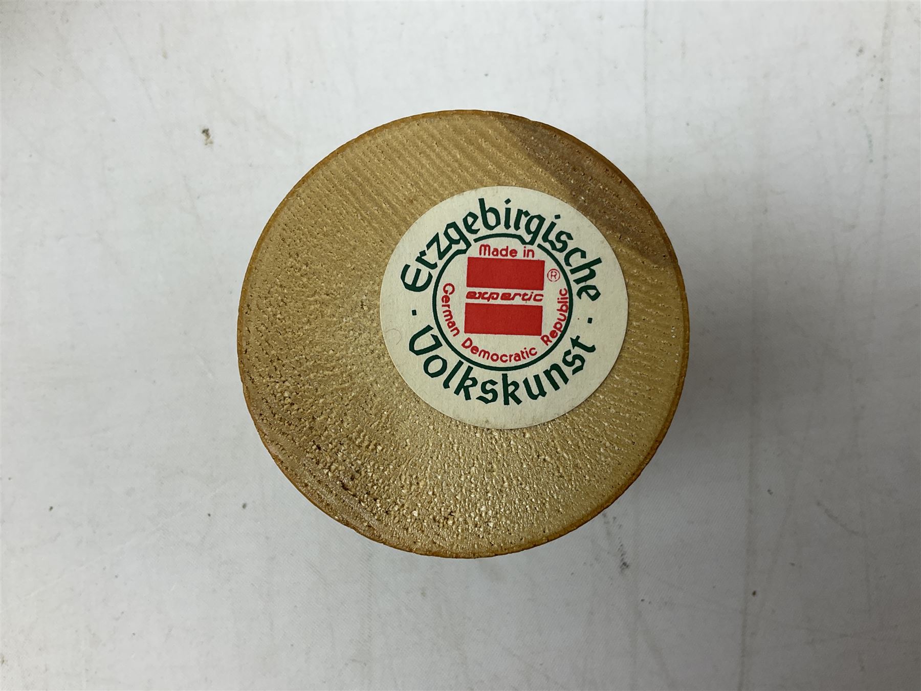 German Erzgebirgische Volkskunst folk art carved and stained wood smoking men incense burner figure, modelled smoking a pipe, with sticker label beneath, H19cm