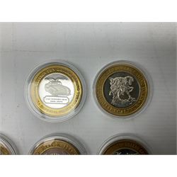 Eight Las Vegas limited edition ten dollar casino silver strike gaming tokens, consisting of a fine silver centre with brass outer ring (8)