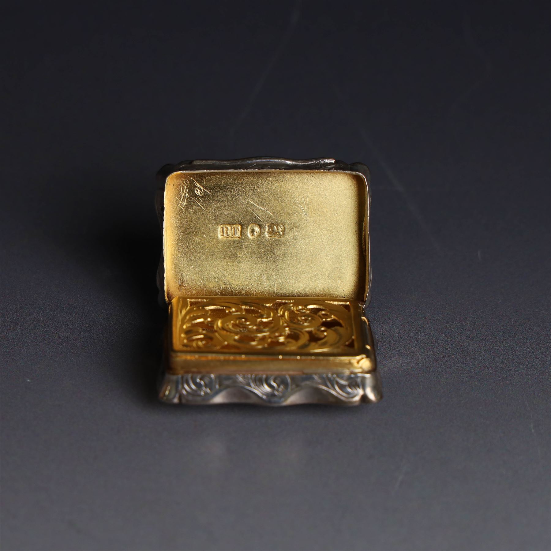 Victorian silver vinaigrette, of typical shaped rectangular form, engraved 'Sincerity' to higned cover bordered by scrolling foliate decoration and with gilt interior, hallmarked Robert Thornton, London 1868