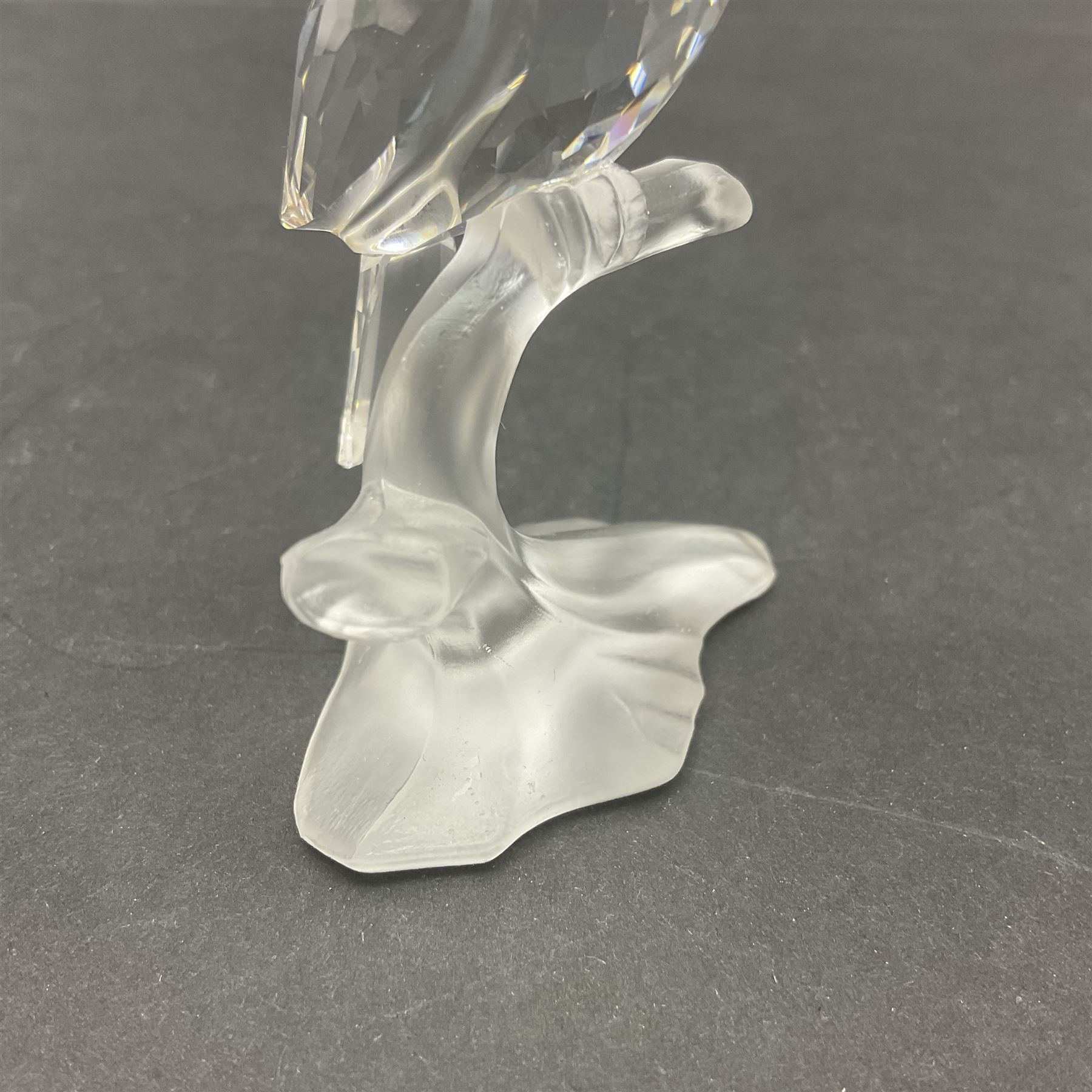 Three Swarovski Crystal bird figures, comprising Toucan, pair of puffins and pair of parrots on a branch, tallest H10cm