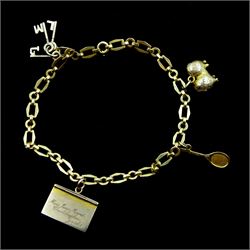 18ct gold link bracelet, with gold charms including Pekingese dog, envelope, tennis racket and keys