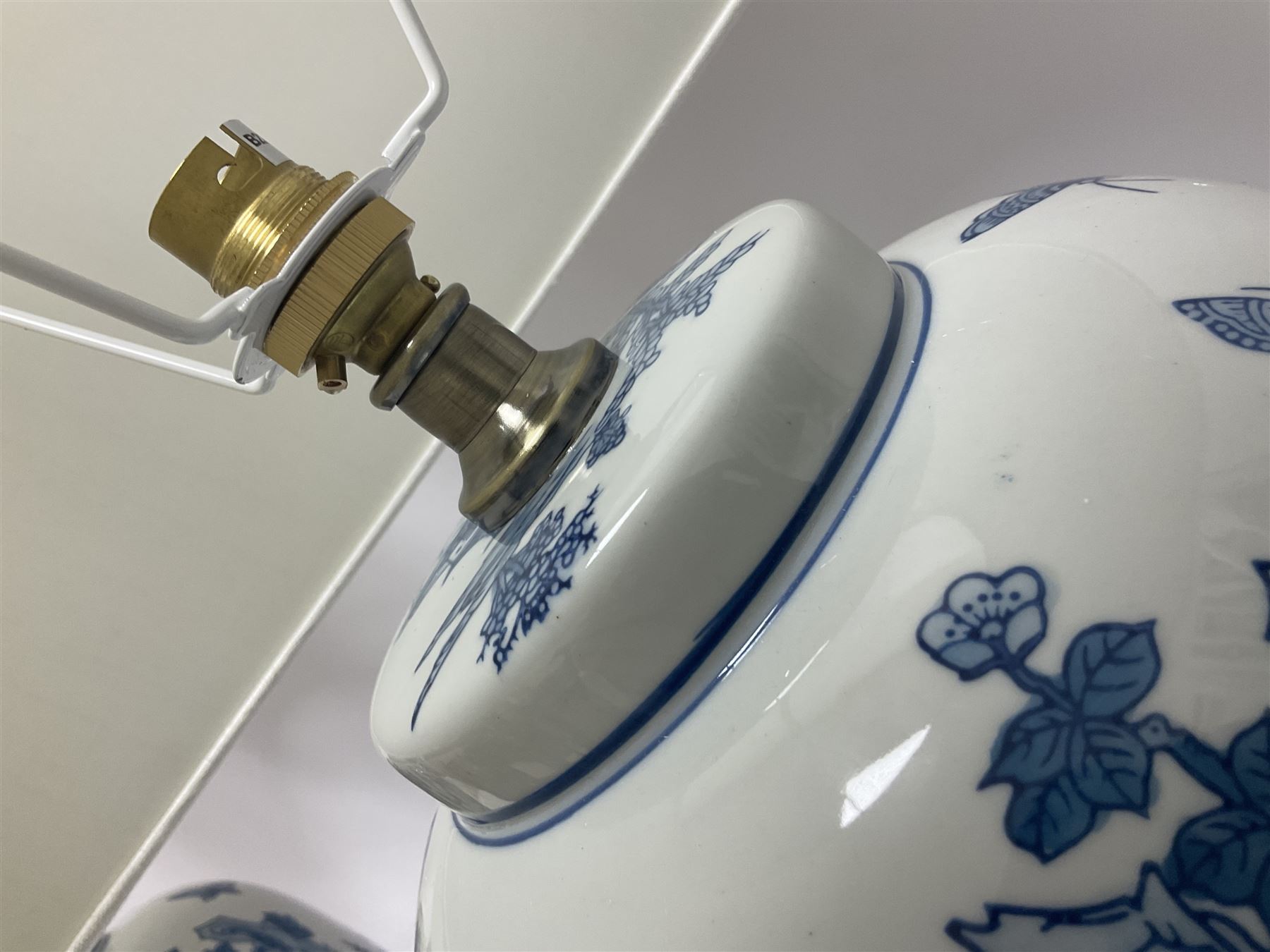 Pair of Chinese table lamps of baluster form, each decorated with landscape scene, raised upon gilt circular base, including shade H63cm