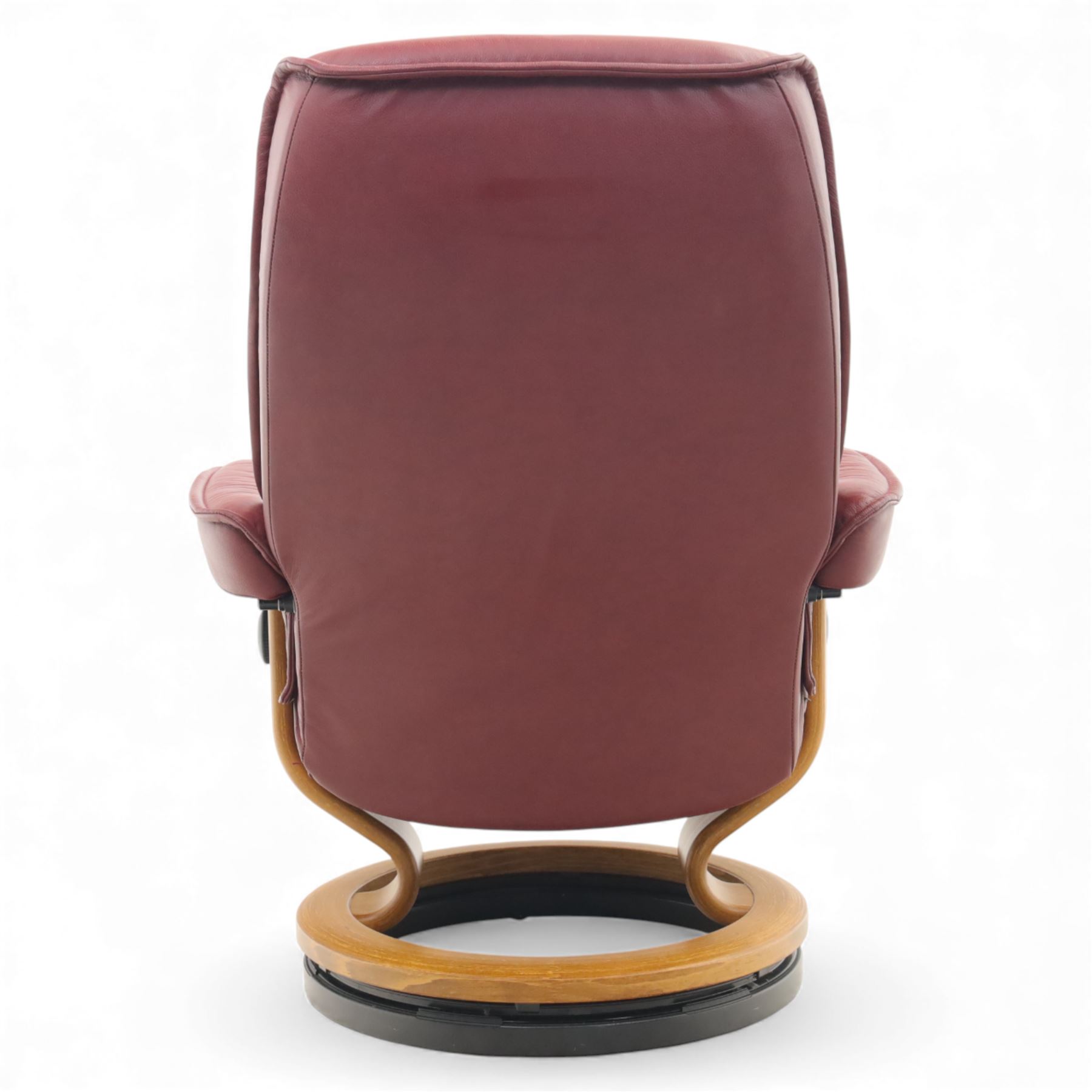 Ekornes - 'Stressless' maroon leather reclining swivel armchair, with high padded back and panel-stitched upholstery, shaped armrests, on a circular laminated wood swivel base