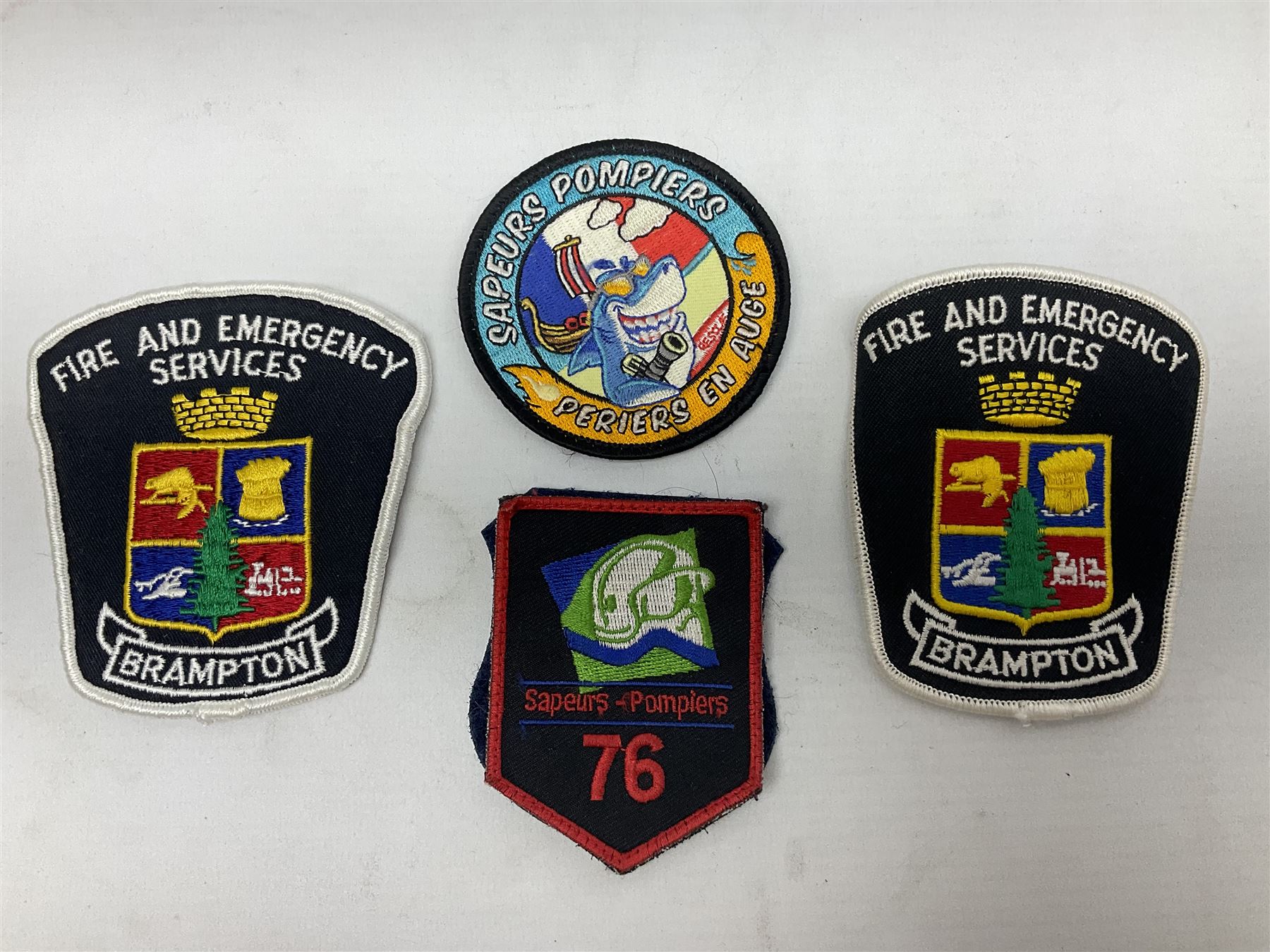 Mid 20th century French Ugeco Nantes first class dress navy blue uniform with ribbon bar with cap, and quantity of Sapeurs Pompiers patches, Sapeurs Pompiers de Caen belt buckle etc