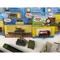 Ertl Thomas the Tank Engine and Friends die-cast models including carded Scrap Trevor, Slate Trucks, Neil, Wilbert, Sodor Taxi, Sodor Recovery Unit, Crane and four key rings; together with various uncarded models including locomotives, coal wagons, steam rollers, boat transporter, recovery units etc (over forty items)