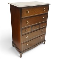 Stag Minstrel - pair of mahogany combination chests, fitted with an assortment of seven drawers with brass ring and pull handles, on bracket feet