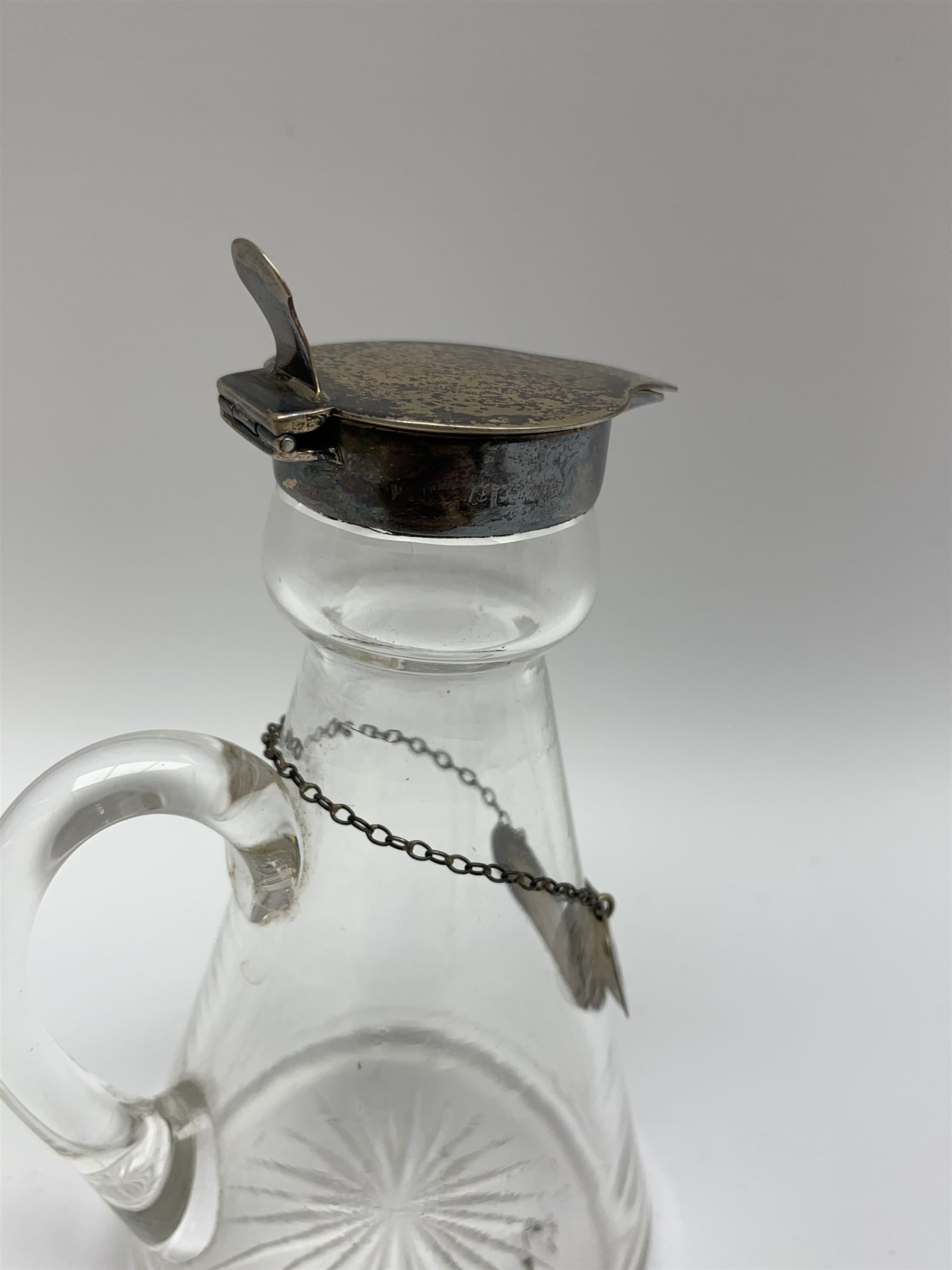Edwardian silver mounted whisky noggin, of tapering cylindrical form with hinged flat cover, H12cm, together with a silver whisky label, each hallmarked H B Johnson & Co, London, whisky noggin dated 1906, label 1910