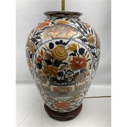 Pair of large and impressive 20th century Japanese Imari table lamps, each of ovoid form, decorated in the Imari palette with roundels containing flowering urns, and shaped panels of birds, set against a white ground decorated with blossoming peonies, lamp base (not including fixtures) H56.5cm overall including shade H89cm