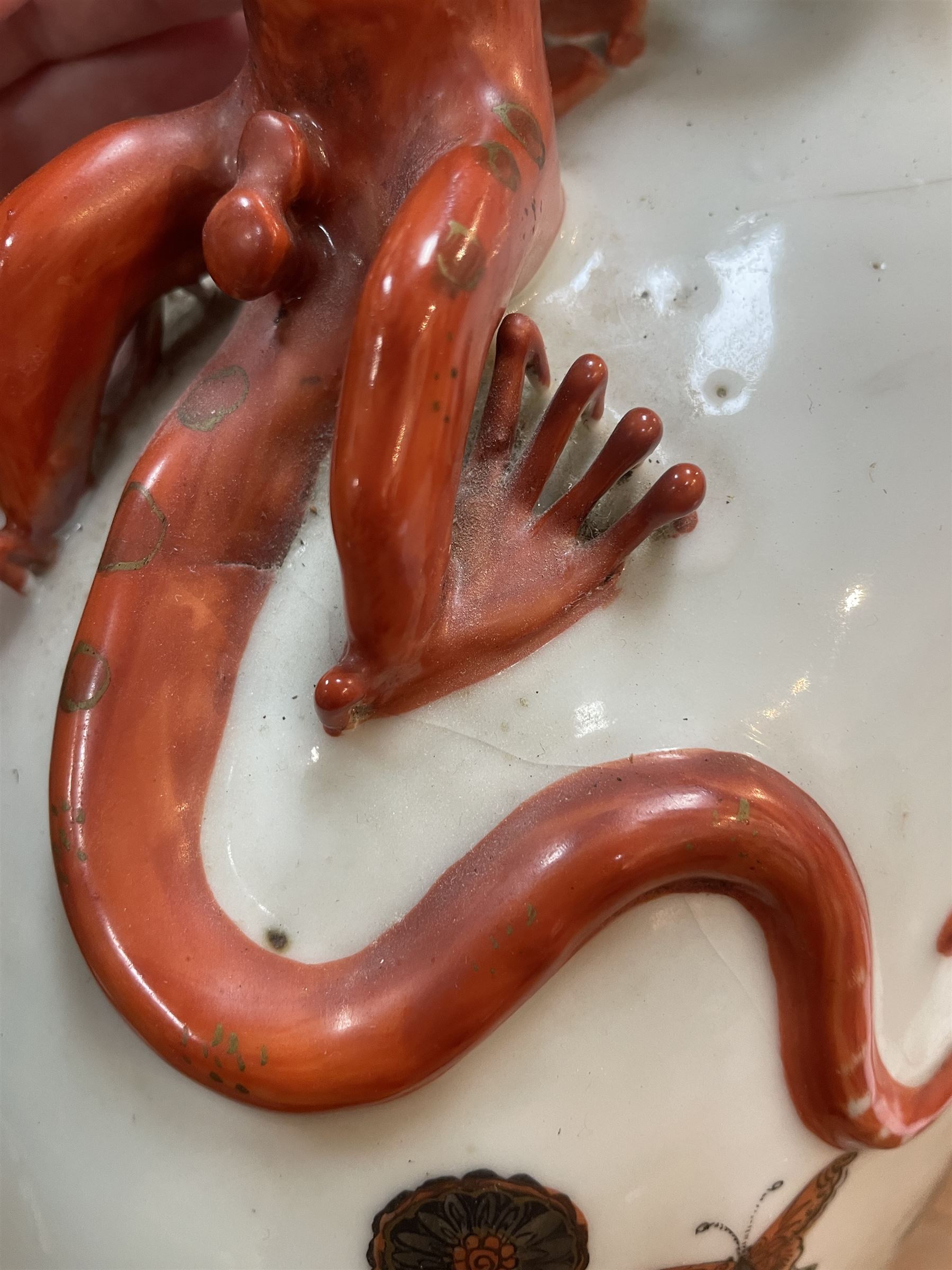 Chinese Republic period porcelain moon flask vase, of typical compressed spherical form, the neck and shoulders with applied iron red dragon handles, the body decorated in iron-red and grisaille with a 'one hundred children' design, depicting various children at play and engaged in musical pursuits within a garden setting, with apocryphal Qianlong mark beneath, H47cm