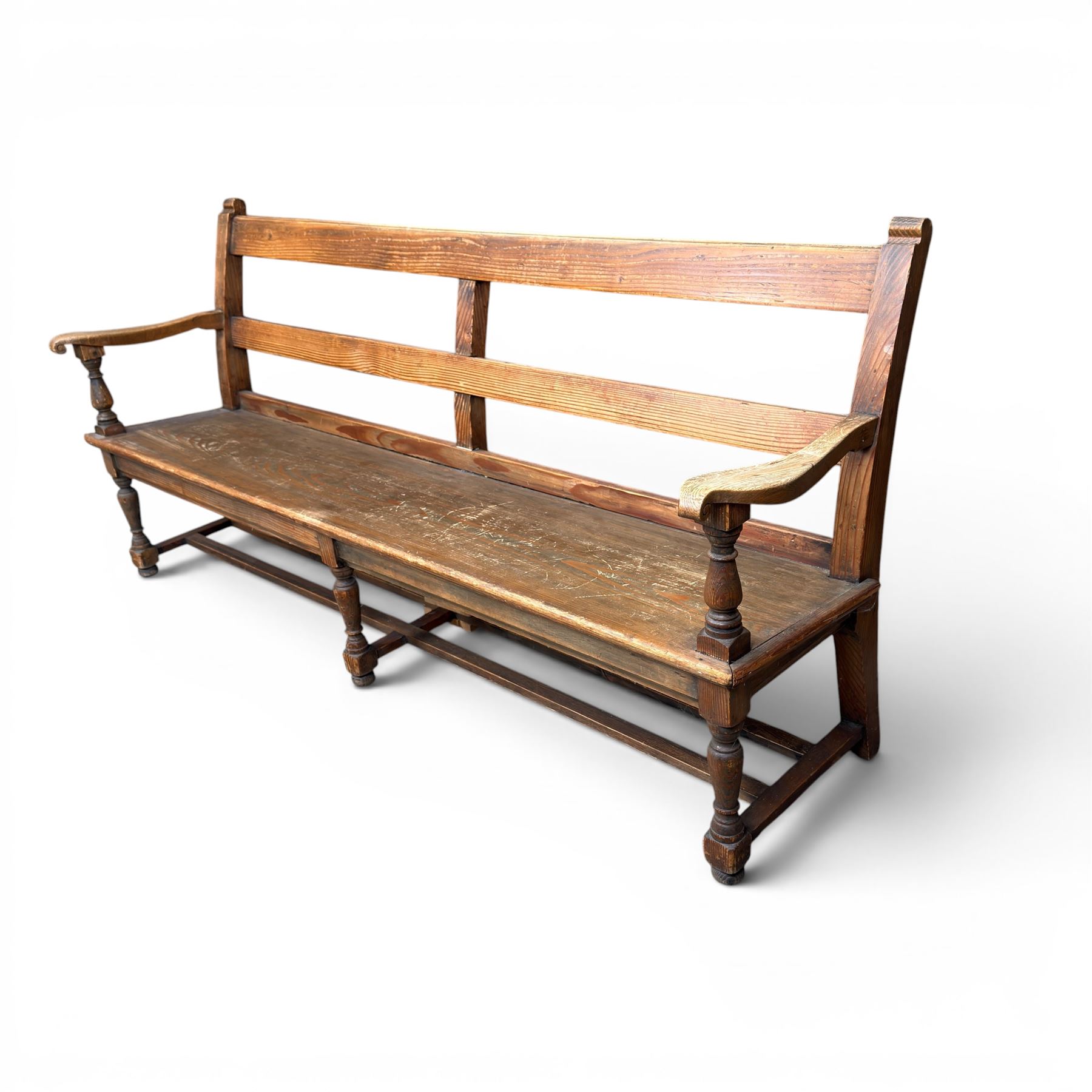 Early 20th century pine and oak bench seat, stained pine rail back frame with shaped oak arms