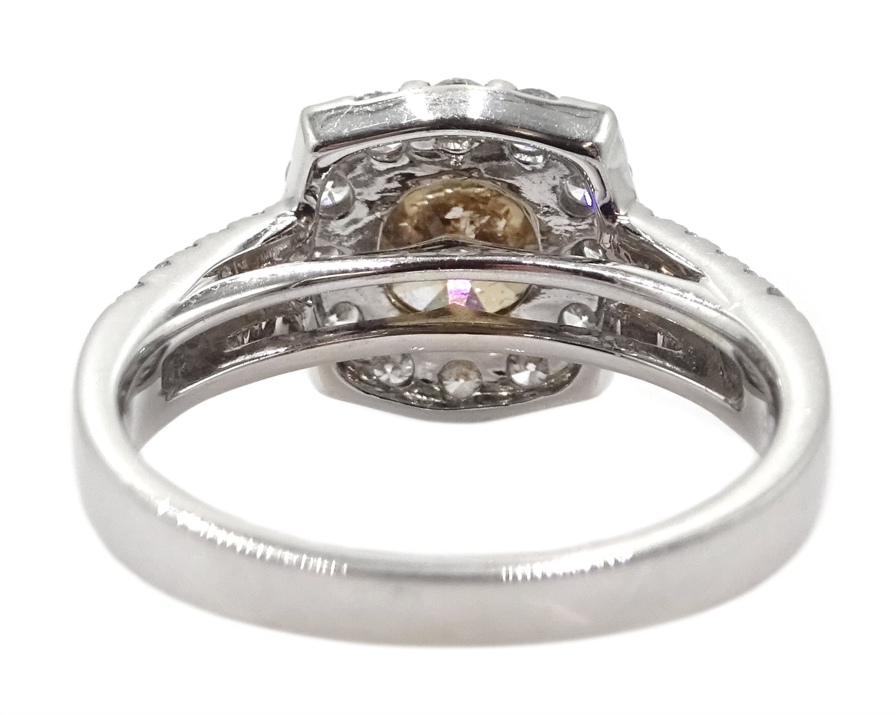 18ct white gold round brilliant cut fancy light brown diamond ring, with halo diamond surround and diamond set shoulders, stamped 750 18K, central diamond 2.00 carat, total white diamond weight 0.90ct