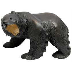 Black Forest style hardwood carving, modelled a bear upon all fours, H22cm