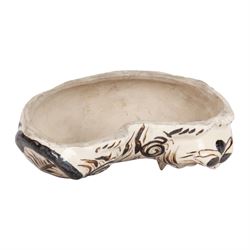 19th century Chinese Cuzhou style glazed pottery model of a cat, modelled in a lying position, and decorated with brown markings upon a cream ground, with opening to back and both ears possibly for incense, H8.5cm L23cm