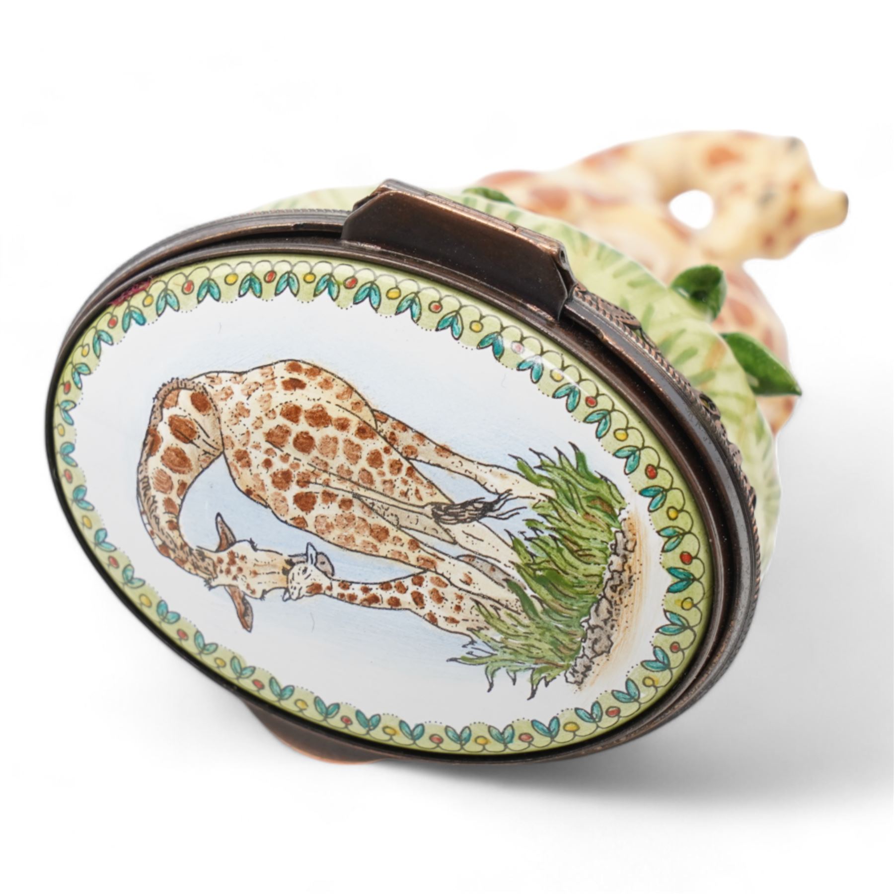 Staffordshire Enamels pomander, two Chelsea Bonbonnieres in the form of a Giraffe and rosebud, together with a Crummles Royal Mail enamel label holder (4)