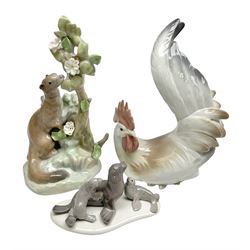 Three Lladro figures, comprising Ermine no 4769, Rooster no 4587 and mini Seal Family no 5318, largest example H24cm