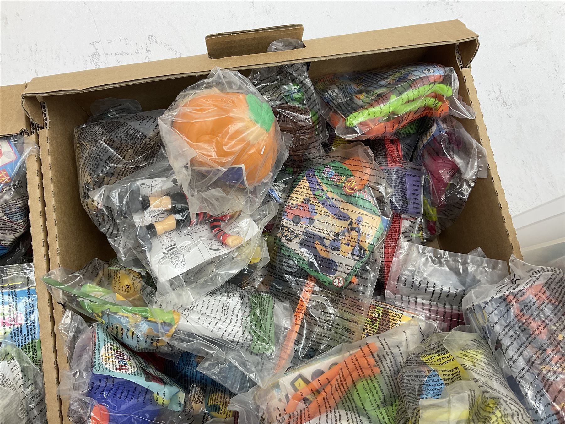 Large quantity of Mcdonalds toys to include Mario in three boxes