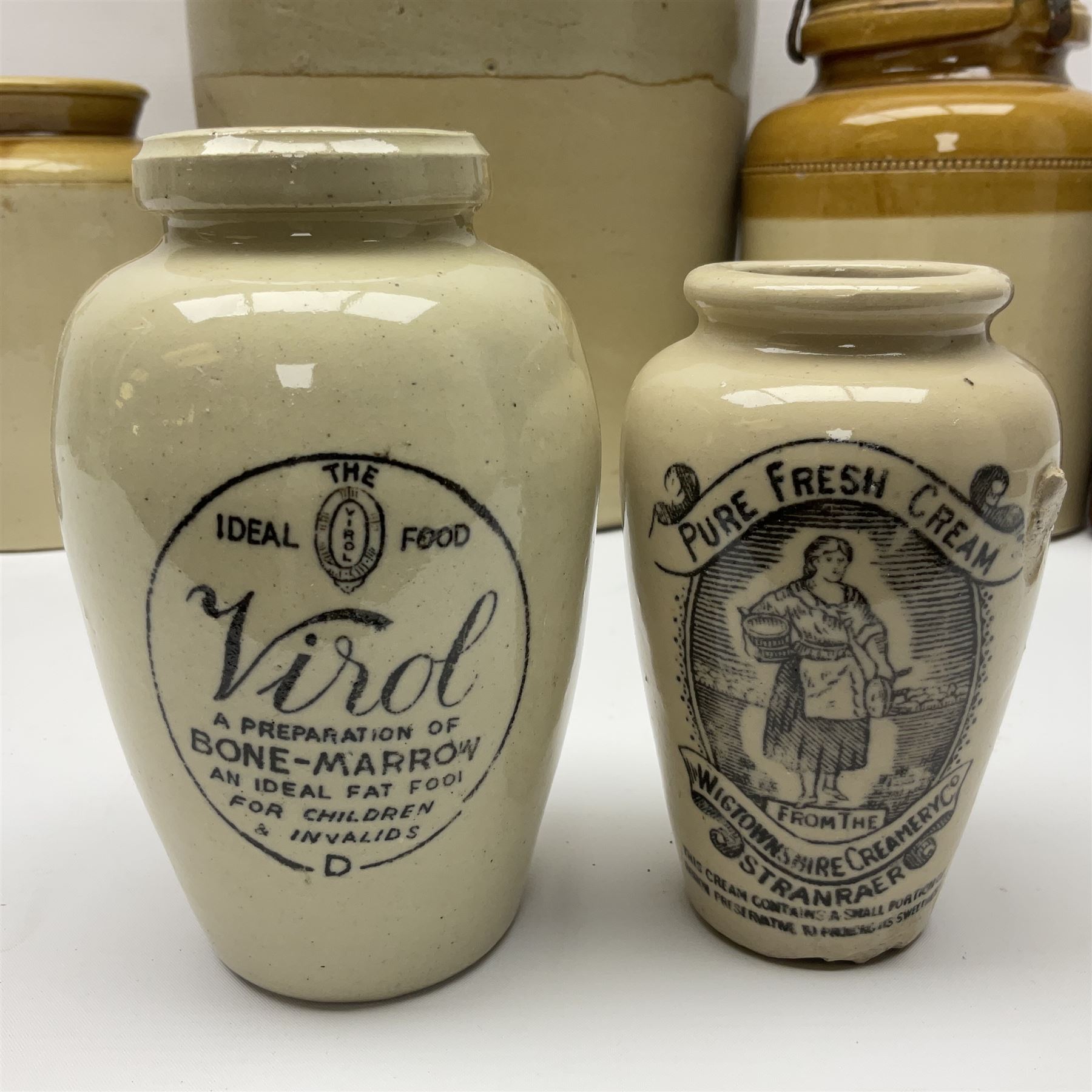 Large 2 gallon stoneware flagon, stamped 'John Soulby Wine Merchant Malton 2 Gall', together with a collection of similar stoneware jars and bottles, largest H40.5cm