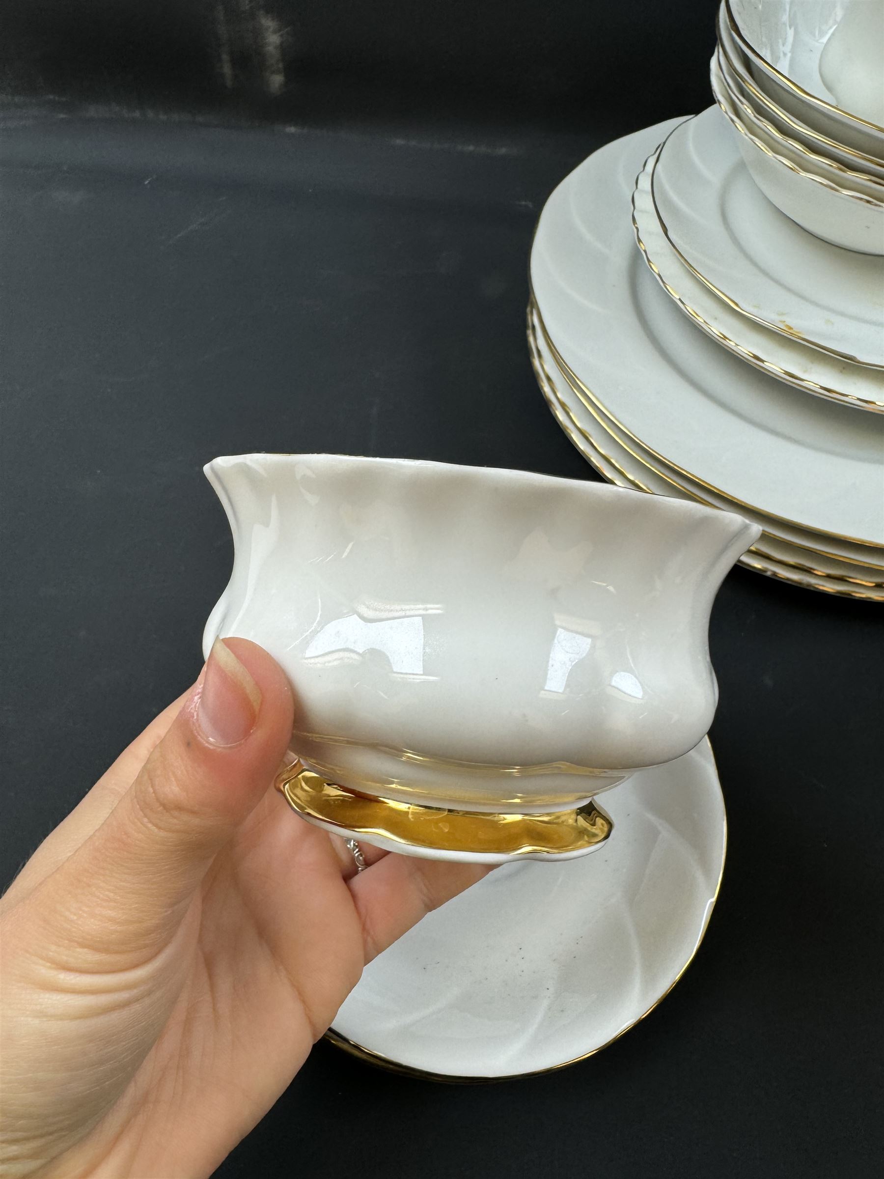 Royal Albert Val D'or part tea and dinner service, including two coffee pots, two teapots, milk jug, covered sucrier etc together with matching items 