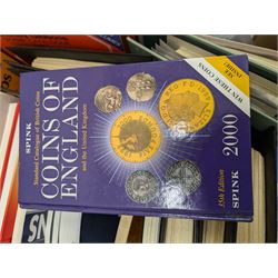 Stamp and coin reference materials, including Stanley Gibbons 2023 'Great Britain Concise' stamp catalogue, various editions of 'The Postal Stationary Society', empty stamp albums etc, in two boxes