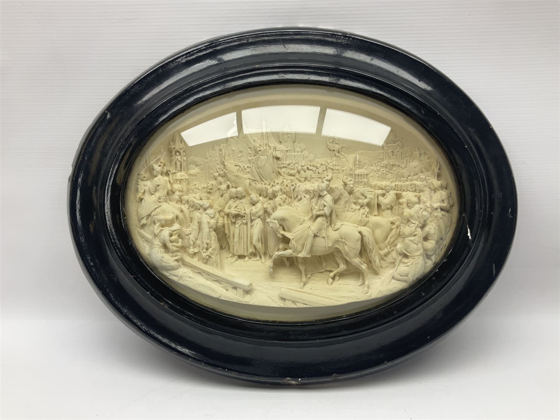 Justin Mathieu; oval high relief plaque depicting a battle scene, within frame H36cm