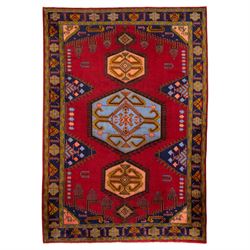 Turkish Anatolian hand-knotted carpet, red field centred by a large pale blue geometric me...