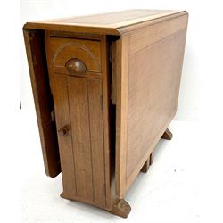 Harris Lebus style oak drop leaf table, two drawers and two cupboards 