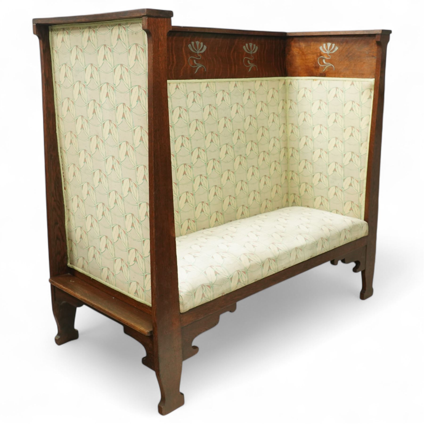 James Shoolbred & Co. (1814-1934) - Arts & Crafts high-back oak settle or hall-bench, the projecting cresting rail over a frieze decorated with stylised poppy pewter inlays, the drop-in sprung seat beneath high back and arms, flanked by tapering uprights terminating to shaped stile feet, upholstered in Archibald Knox patterned fabric with the original tapestry and horsehair upholstery beneath, applied plaque by James Shoolbred to underside, with stamped serial number W1573, circa 1890