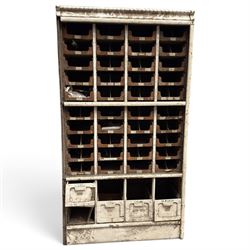 F Pollard & Co - late 19th century rustic haberdashery shop cabinet, fitted with an assortment of forty sliding trays, with drawers fitted to base, in antique white-painted finish
