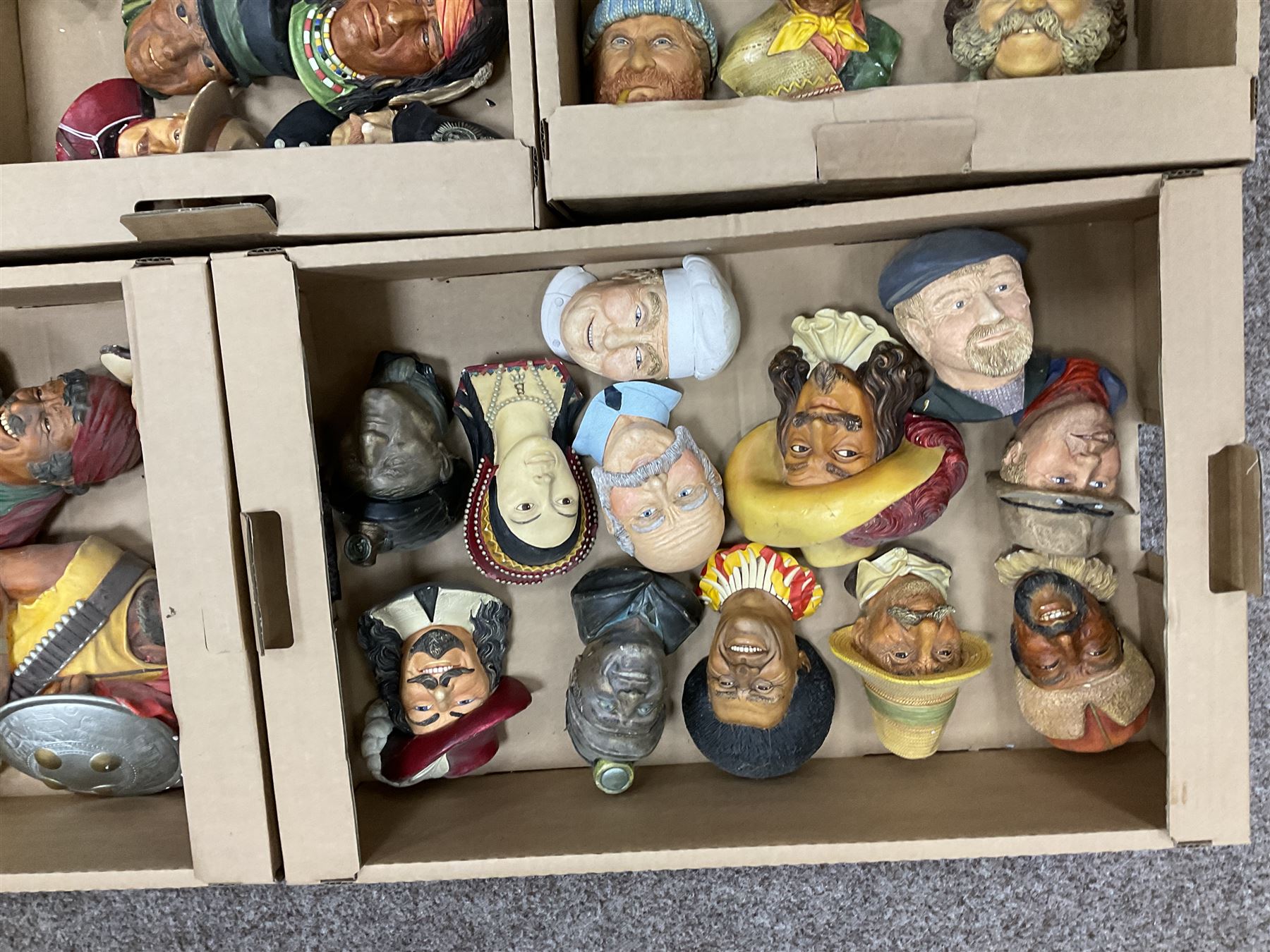 Large collection of Bossons plaster wall-masks, including including fisher man, policeman, highway man, etc, in four boxes 