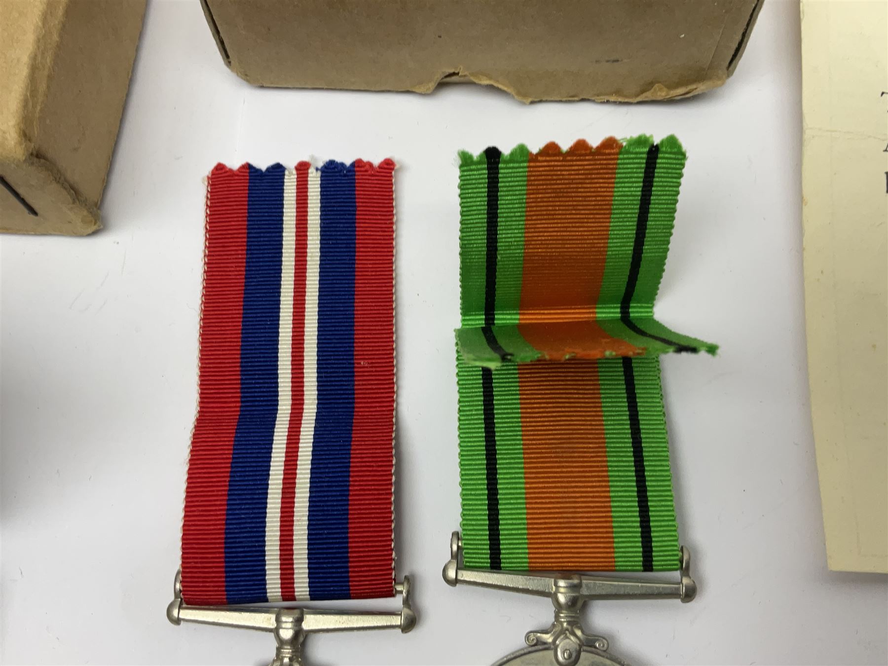 WWI pair of medals comprising British War Medal and Victory Medal awarded to 380807 Pte. W. Hayles Hamps. R.; Imperial Service Medal awarded to William Hayles; cased and boxed; WWII 1939-1945 War Medal and Defence Medal in issue box with slip; 1930s hallmarked silver football presentation fob etc