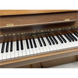 John Brinsmead upright piano, teak cased, iron framed and overstrung with piano stool 
