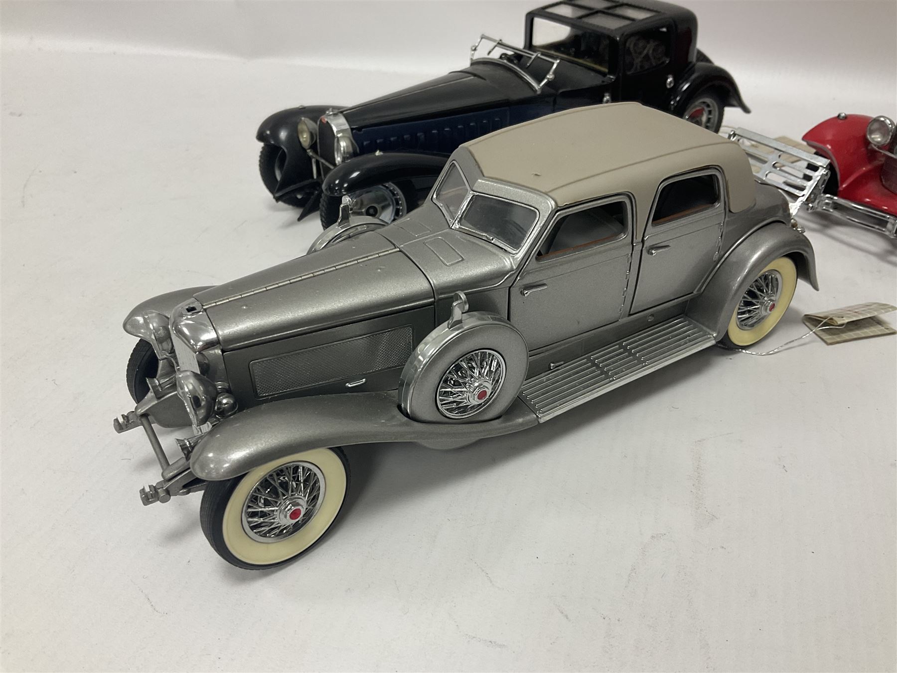 Franklin Mint - five 1:24 scale die-cast precision models comprising 1930 Bugatti Royale Coupe Napoleon, 1933 Duesenberg SJ Twenty Grand, 1935 Mercedes Benz 500K Special Roadster, 1938 Jaguar SS-100, and 1947 Bentley 