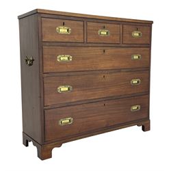 Georgian military type campaign chest, narrow rectangular top over three short and three long drawers, recessed brass handles, on bracket feet