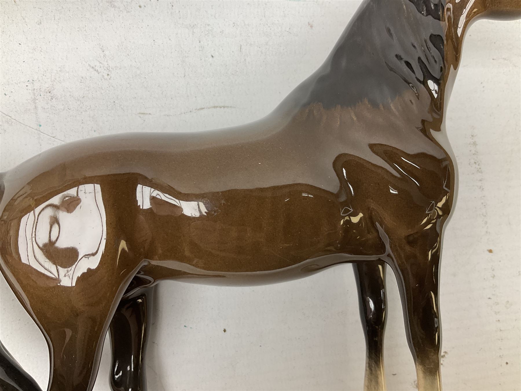 Seven Beswick figures of horses, including Connemara pony in grey no.1641, Arab in bay no.1265, large foal in grey no.947 etc, together with a Goebel figure of a horse (8)