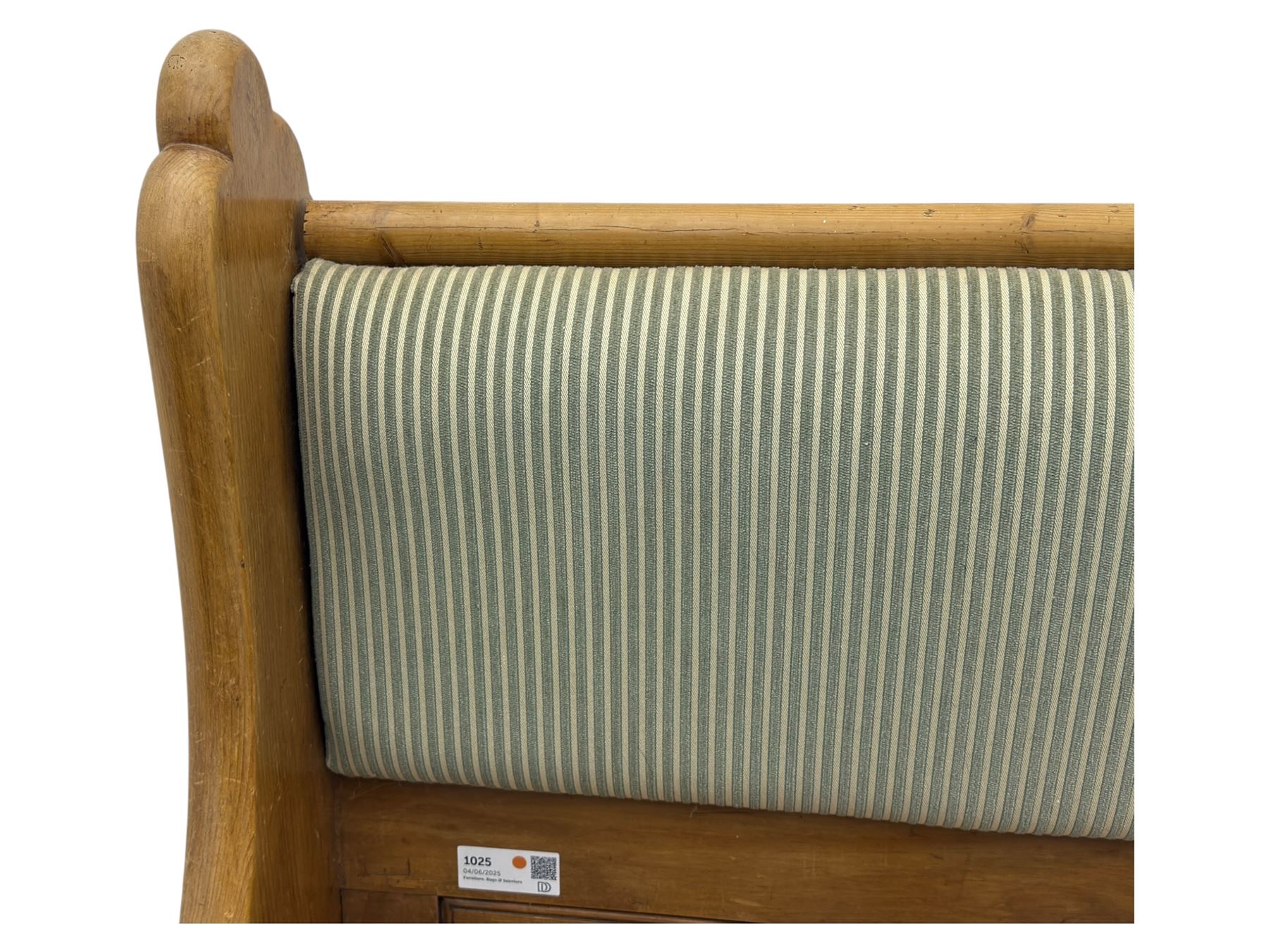 Early 20th century waxed pine pew, inset upholstered striped back panel with hinged box seat enclosing storage, shaped arms and turned supports