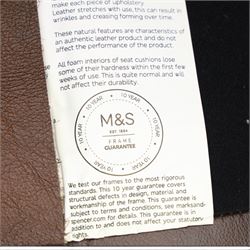 Marks & Spencer - Pair of brown leather wing back chairs, raised on light stained supports with castors