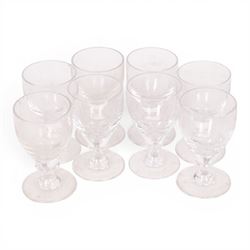 Georgian shaped drinking glasses, comprising eleven larger, H12.5cm, and eight smaller, H10.5cm, each with ovoid bowl upon knopped stem and circular foot